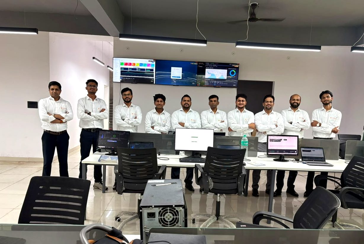 CyboWatch SOC team standing in front of live threat monitoring dashboards